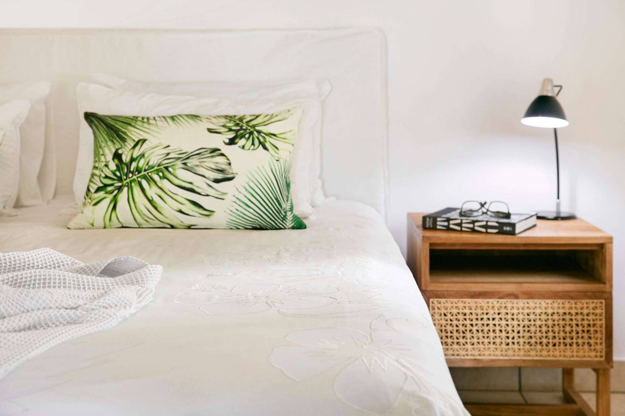 Cook Islands hotel room with white bed linen